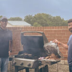 Four BP volunteers helping with the grill for our Adult Day Program clients.