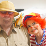 Two cheerful clown volunteers at an LOH event.