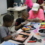 Two youth clients working on an art project.