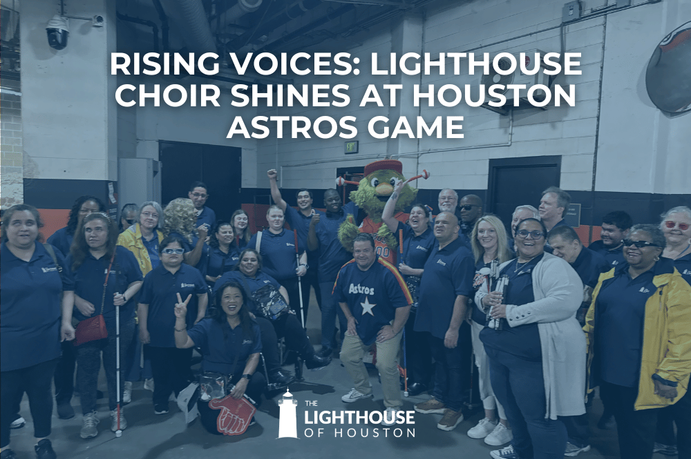 Photo of The Lighthouse Choir with Director and guides with Astros mascot, Orbit, in the stadium concourse.