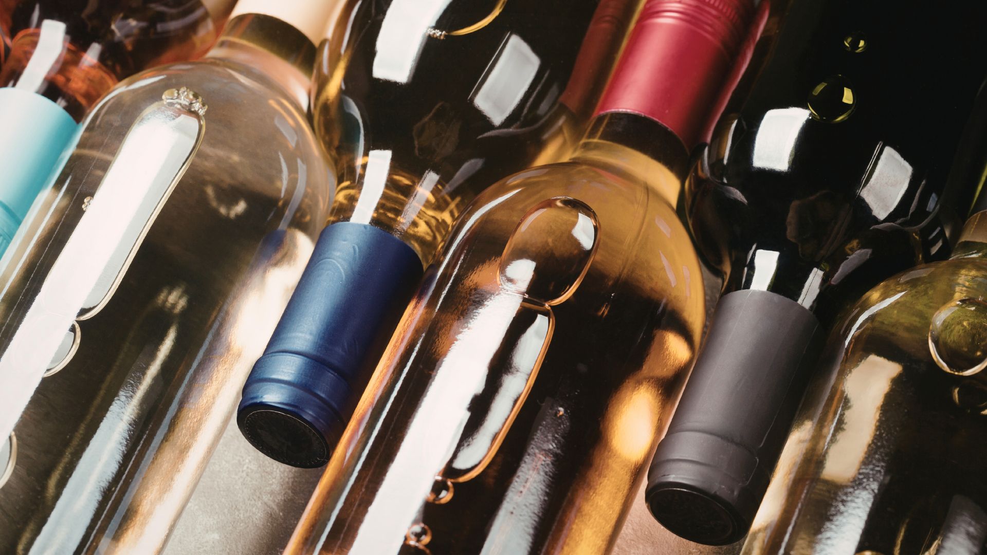 A close-up photo of six wine bottles.