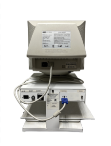 The back of an old computer monitor and base unit, showing various ports and labels including AC IN, RESET, AC OUT, PC MONITOR, and VIDEO.