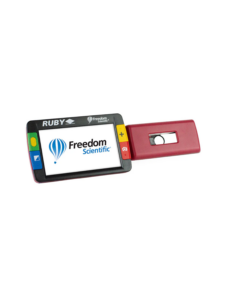 A Ruby handheld digital magnifier with a screen displaying the Freedom Scientific logo and a red attachment with a viewing window.