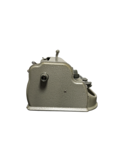 A side view of a vintage gray typewriter with black keys.