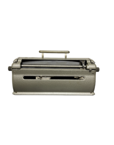 A side view of a vintage gray typewriter with black keys.