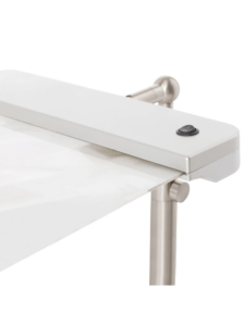 A close-up shot of a silver desk magnifier witha silver metal frame and a black on/off switch.